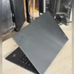 Lenovo ThinkPad X1 Carbon Gen 7 lid with X1 logo, angled rear view